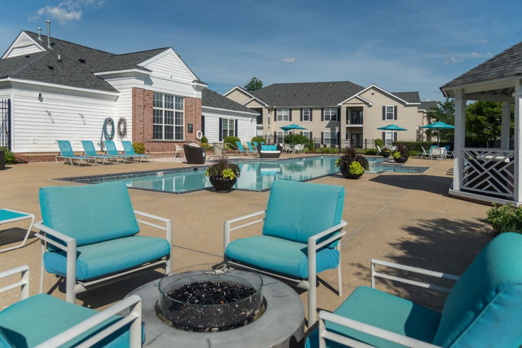 Blue chairs and a blue pool