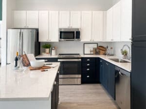Open kitchen with white and black cabinetry