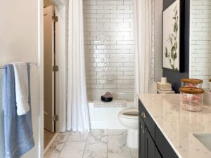 a white tiled bathroom