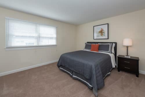 blue bedspread in guest room at walkers chase townhomes