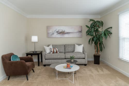 grey couch in living room at walkers chase townhomes